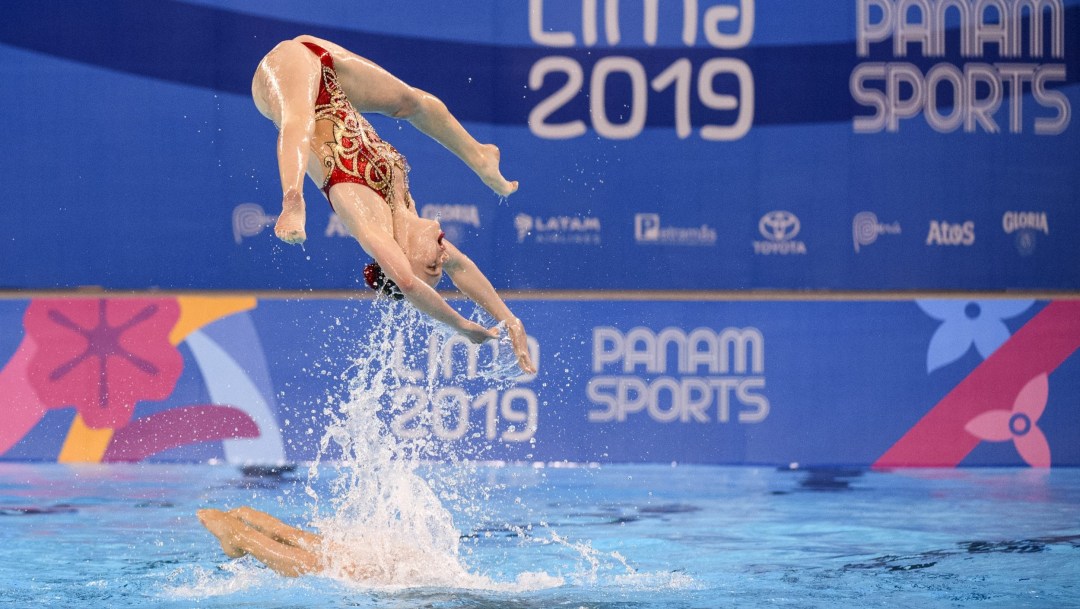 Emily Armstrong performs an upside down split in the air