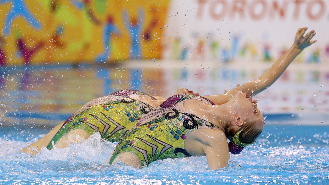 Two synchronized swimmers competing