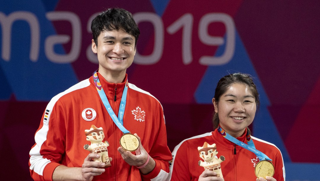 Joshua Hurlburt-Yu and Josephine Wu celebrate Mixed Badminton Gold at the 2019 Pan Am Games in Lima, Peru