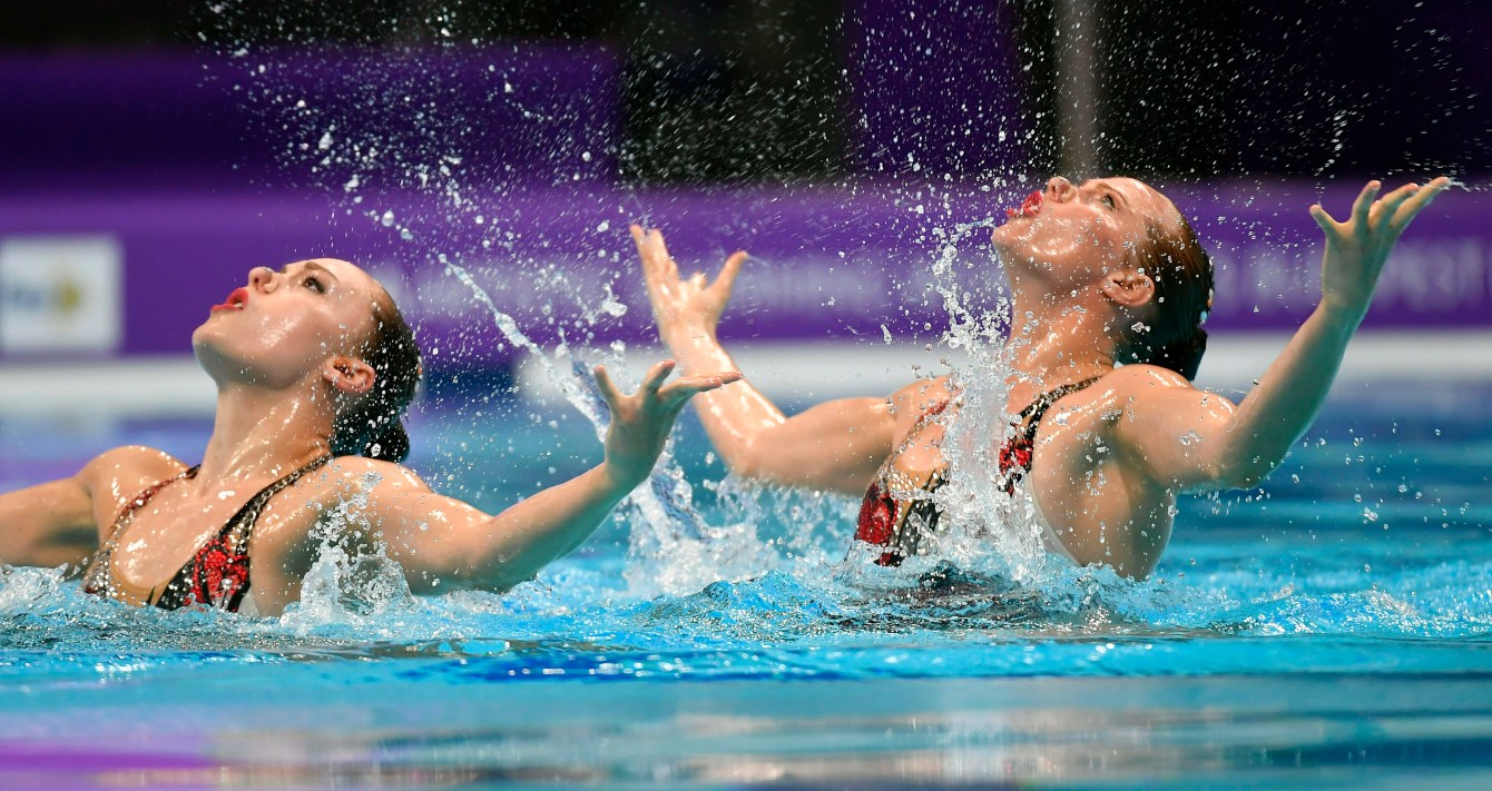 Claudia Holzner and Jacqueline Simoneau of Canada perform in the synchronized swimming duet