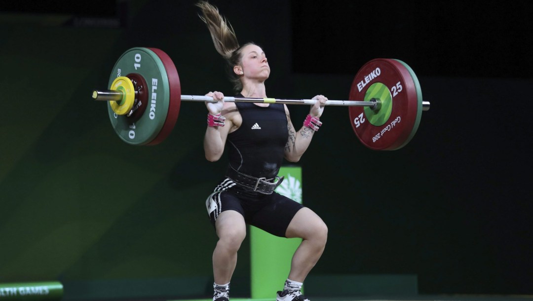 Female weightlifting in the middle of a lift
