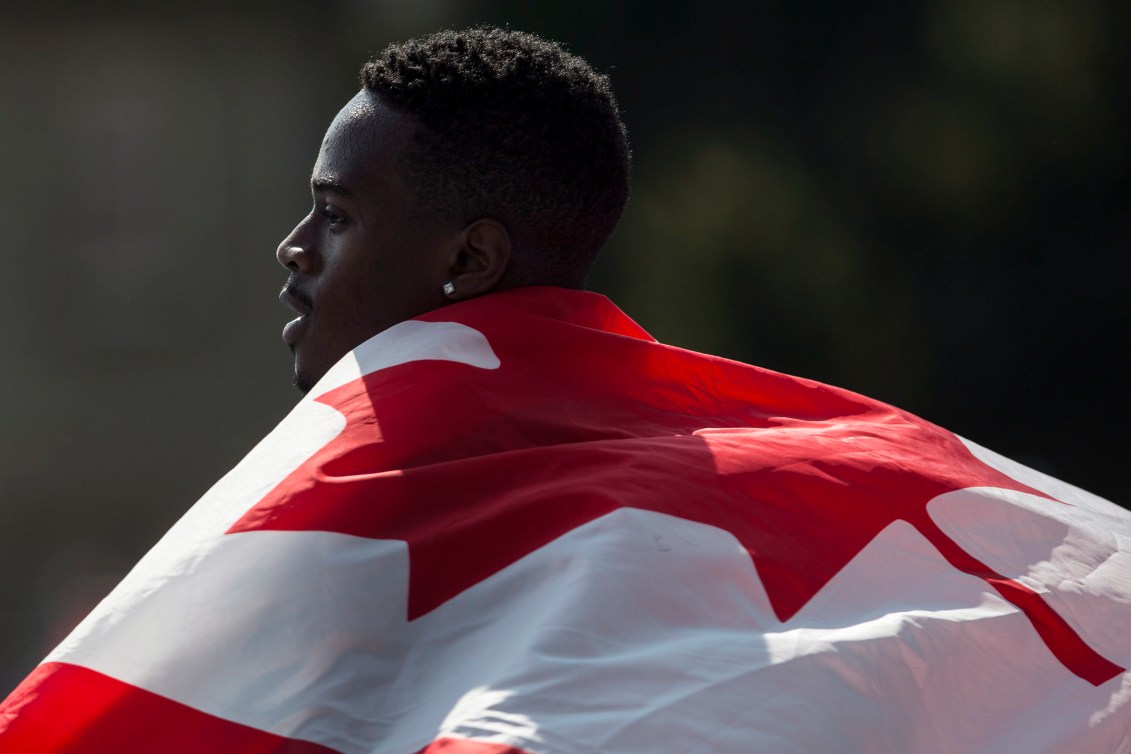 Aaron Brown with Canadian flag on his back