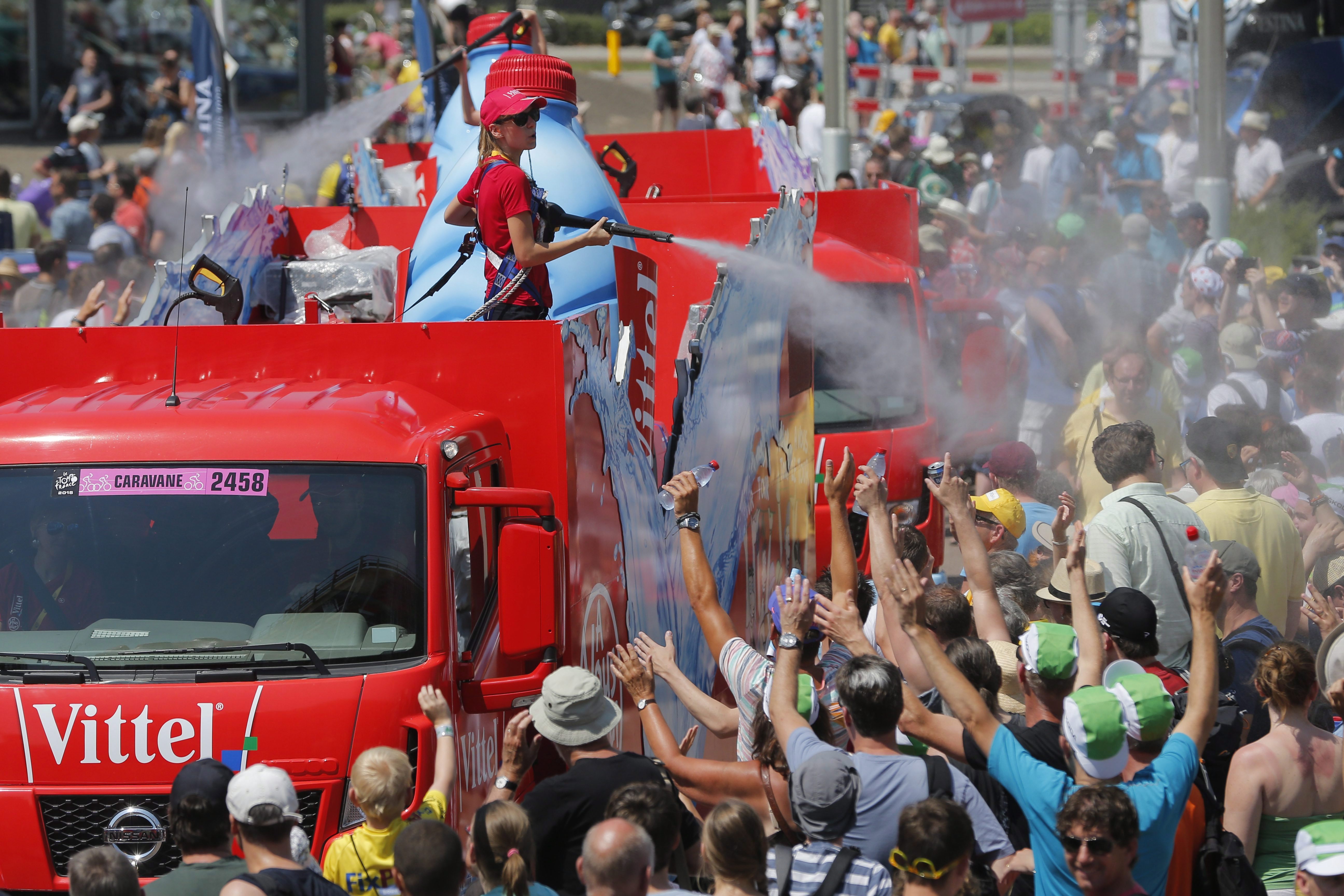 The publicity caravan sprays water on spectators