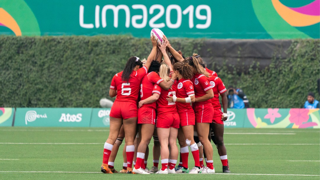 Rugby team huddling