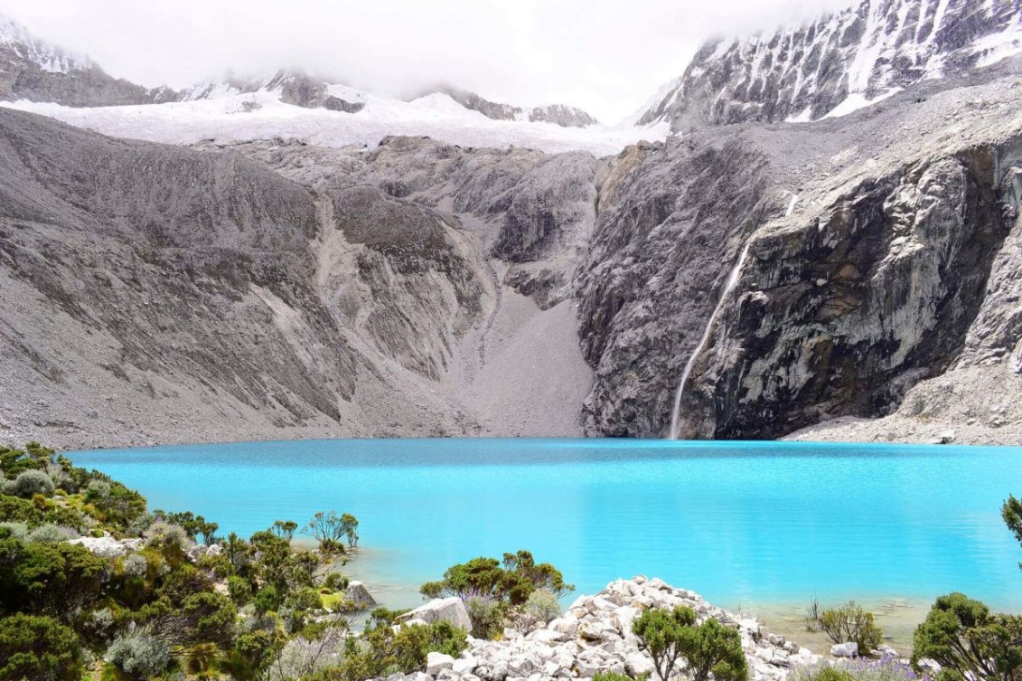 Beautiful aqua lake with mountains in the background