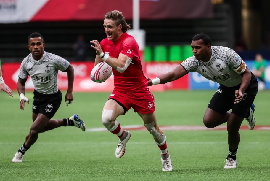 Luke McCloskey (5) runs the ball