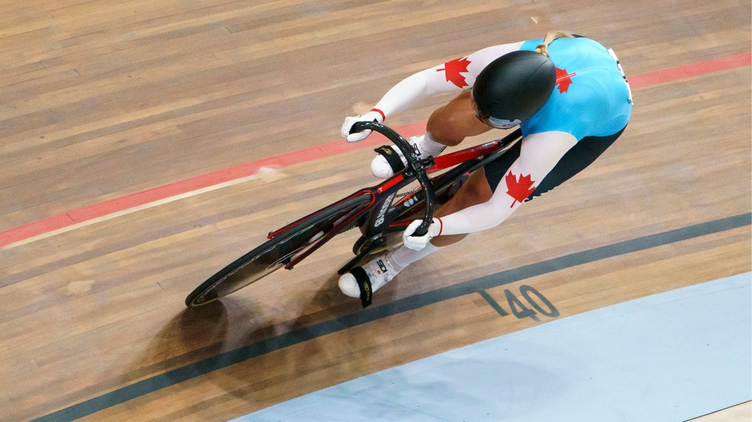 Cyclist on velodrome track