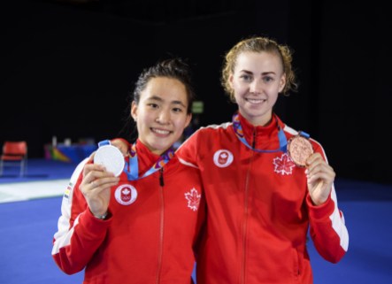 team-canada-guo-harvey Jessica (left) and Eleanor hold up their gold and bronze medals