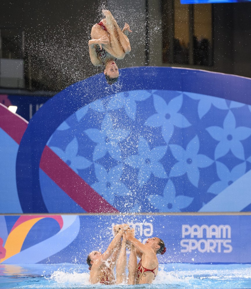 artistic swimmer flies in the air