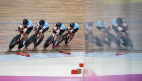 team-canada-lima-cycling four cyclists on a track