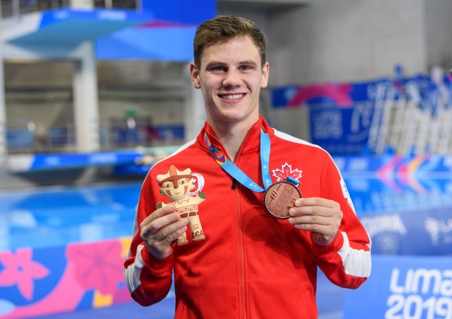 team-canada-vincent-rindeau athlete holds up his medal