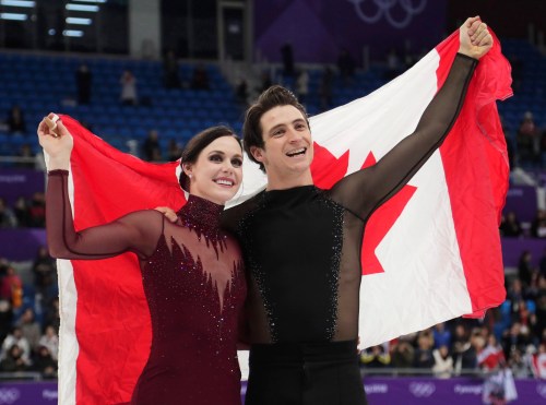 Tessa Virtue and Scott Moir of Canada celebrate