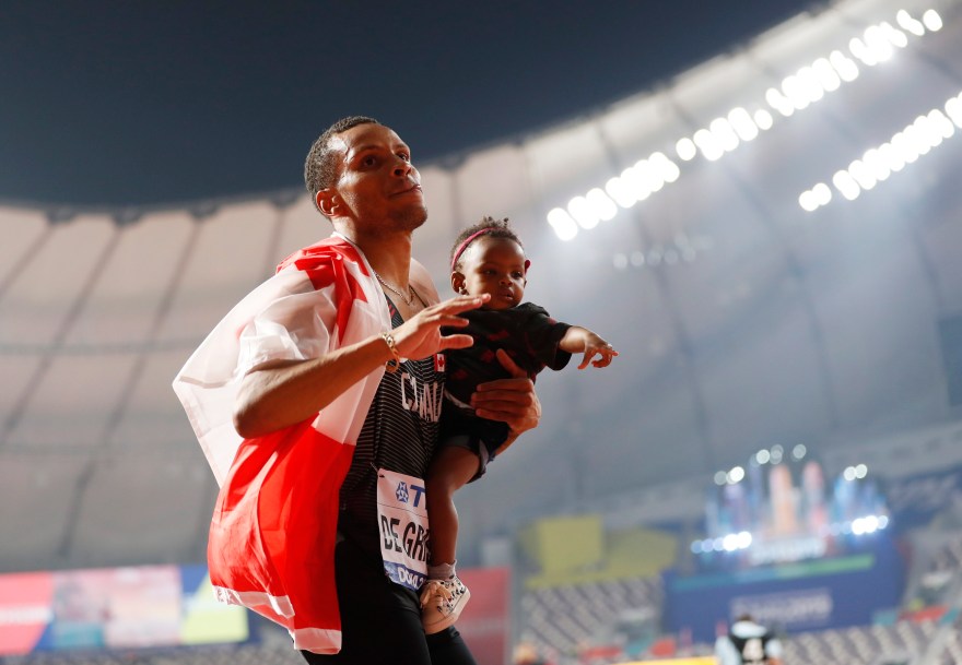 Andre de Grasse celebrating with his child