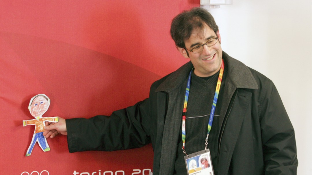 Randy Starkman posing with drawing