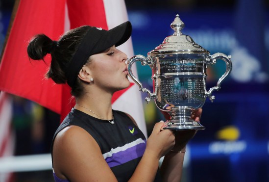 Bianca Andreescu, of Canada, kisses the championship trophy