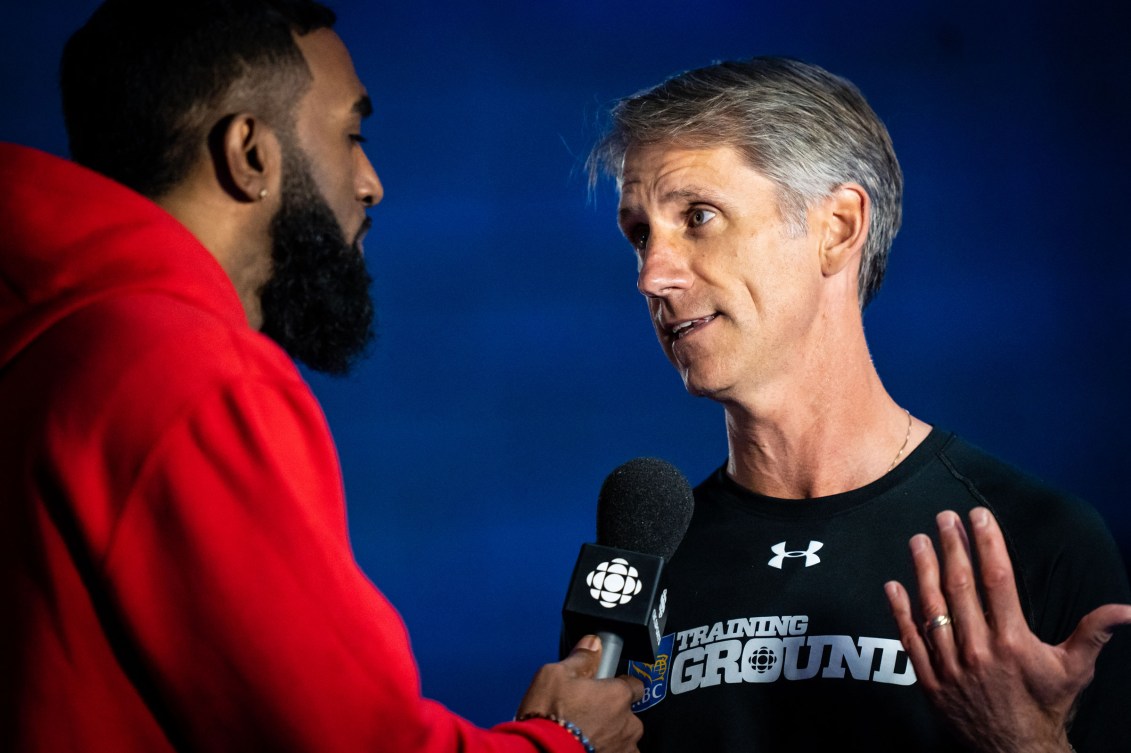 Anson Henry (left) interviews Kurt Innes.