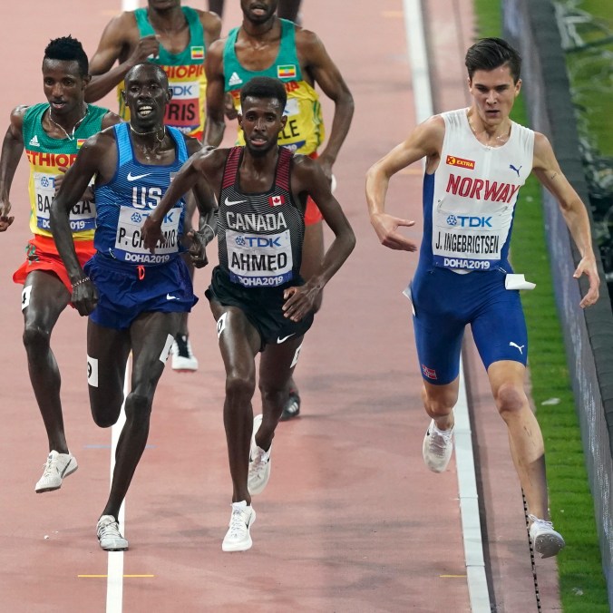 Qatar Athletics Worlds Mohammed Ahmed leads the race against a Norwegian, an American, and three Ethiopians during the 5000 metre race in Doha.