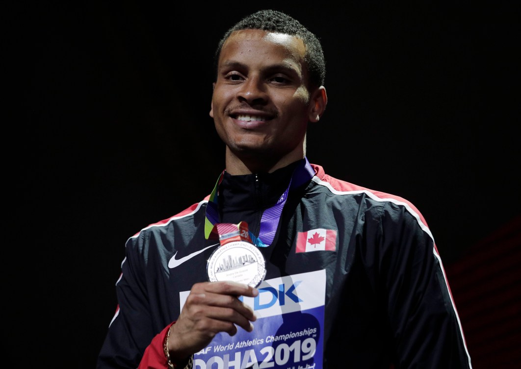 Andre de Grasse holding silver medal