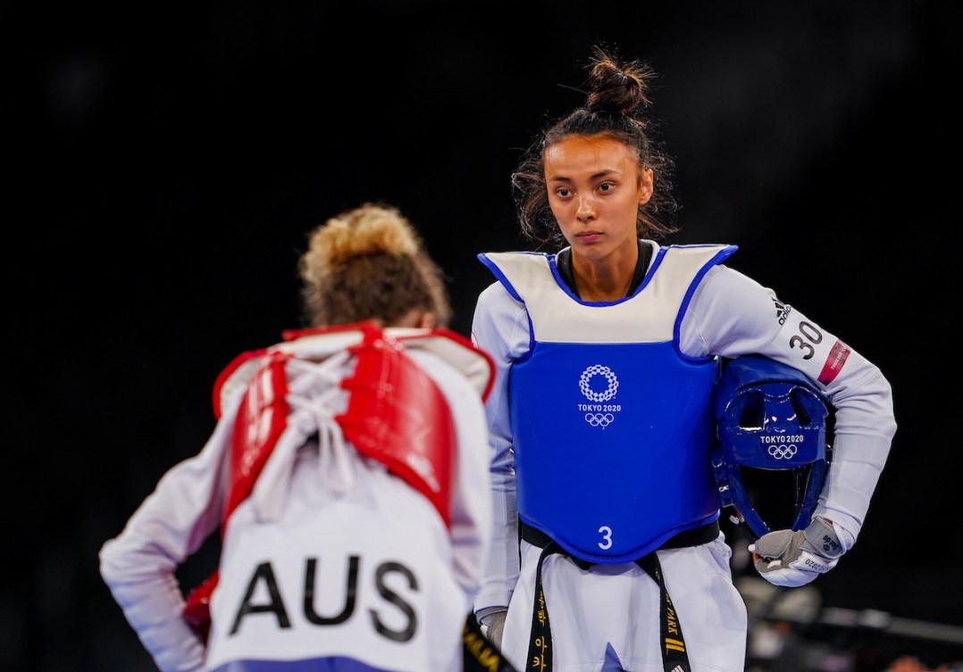 Canadian Taekwondo fighter Skylar Park, blue, battles against Stacey Hymer of Australia during the Tokyo 2020 Olympic Games on Sunday, July 25, 2021. Photo by Stephen Hosier/COC