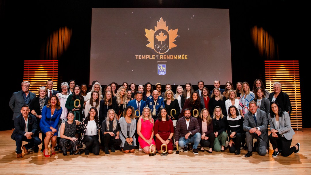 Group of people posing for photo at Canadian Olympic Hall of Fame induction ceremony