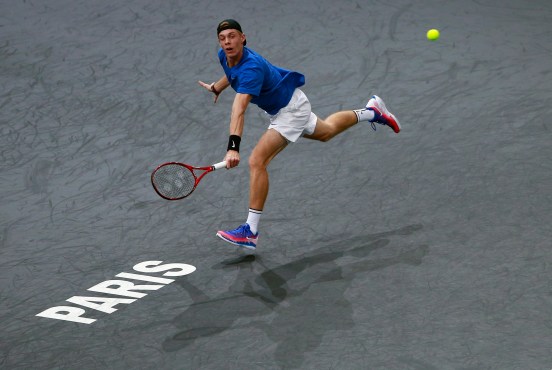 Denis Shapovalov of Canada returns a ball