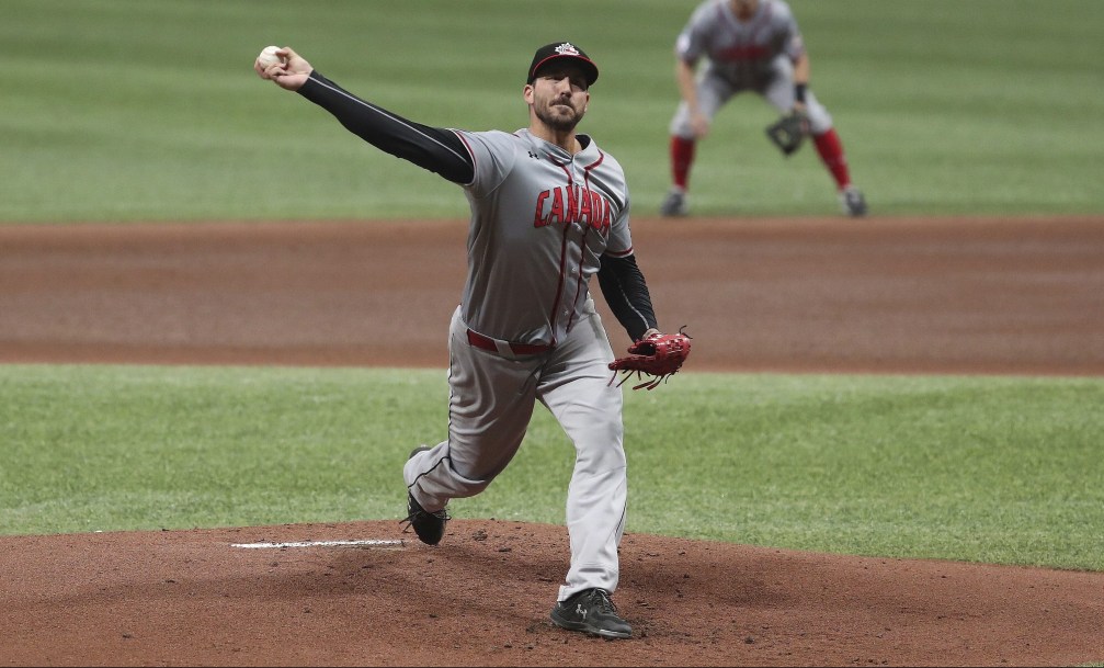 Phillippe Aumont throws a pitch