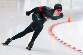Graeme Fish rounds a corner in a speed skating race