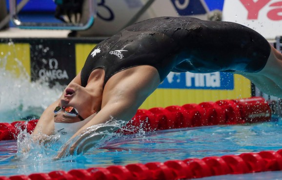 Kylie Masse dives into the water