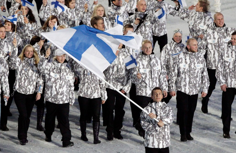 Finland's Ville Peltonen carries the flag during the opening ceremony for the Vancouver 2010 Olympics in Vancouver, British Columbia, Friday, Feb. 12, 2010.