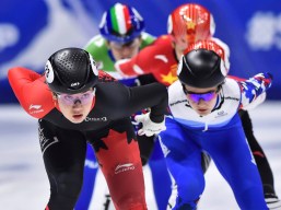Team Canada's Courtney Sarault competes in a speed skating competition