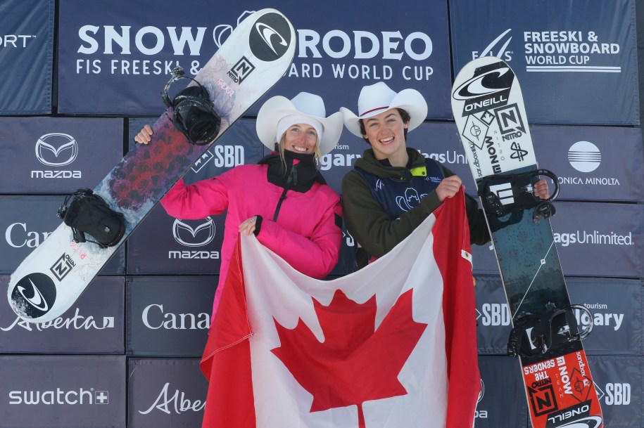 Gold medalist Laurie Blouin of Canada celebrates with Men's bronze medalist Liam Brearley of Canada in the finals of the FIS Snowboard World Cup