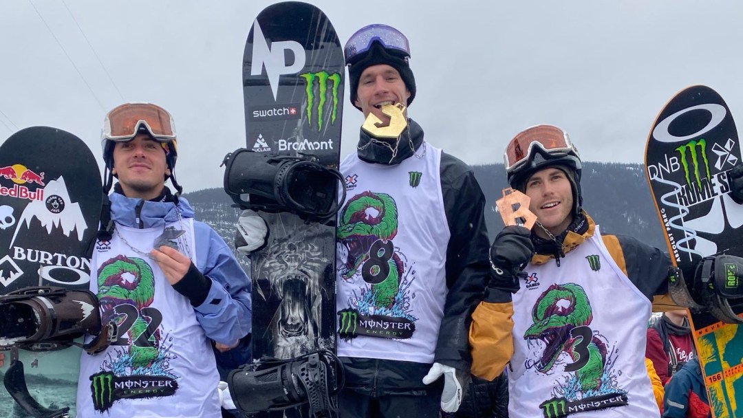 Slopestyle snowboard medallists stand on the podium including Max Parrot and Mark McMorris.