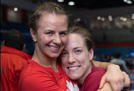 Erica Wiebe (left) and Danielle Lappage hug.