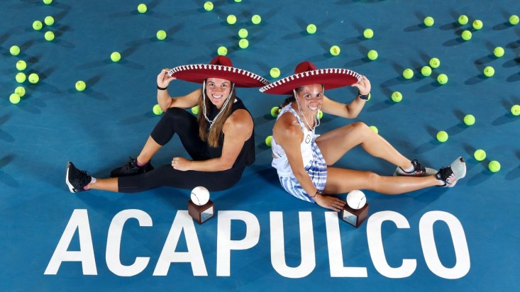 Sharon Fichman (right) and Kateryna Bondarenko of Ukraine pose for a photo with Mexican hats.