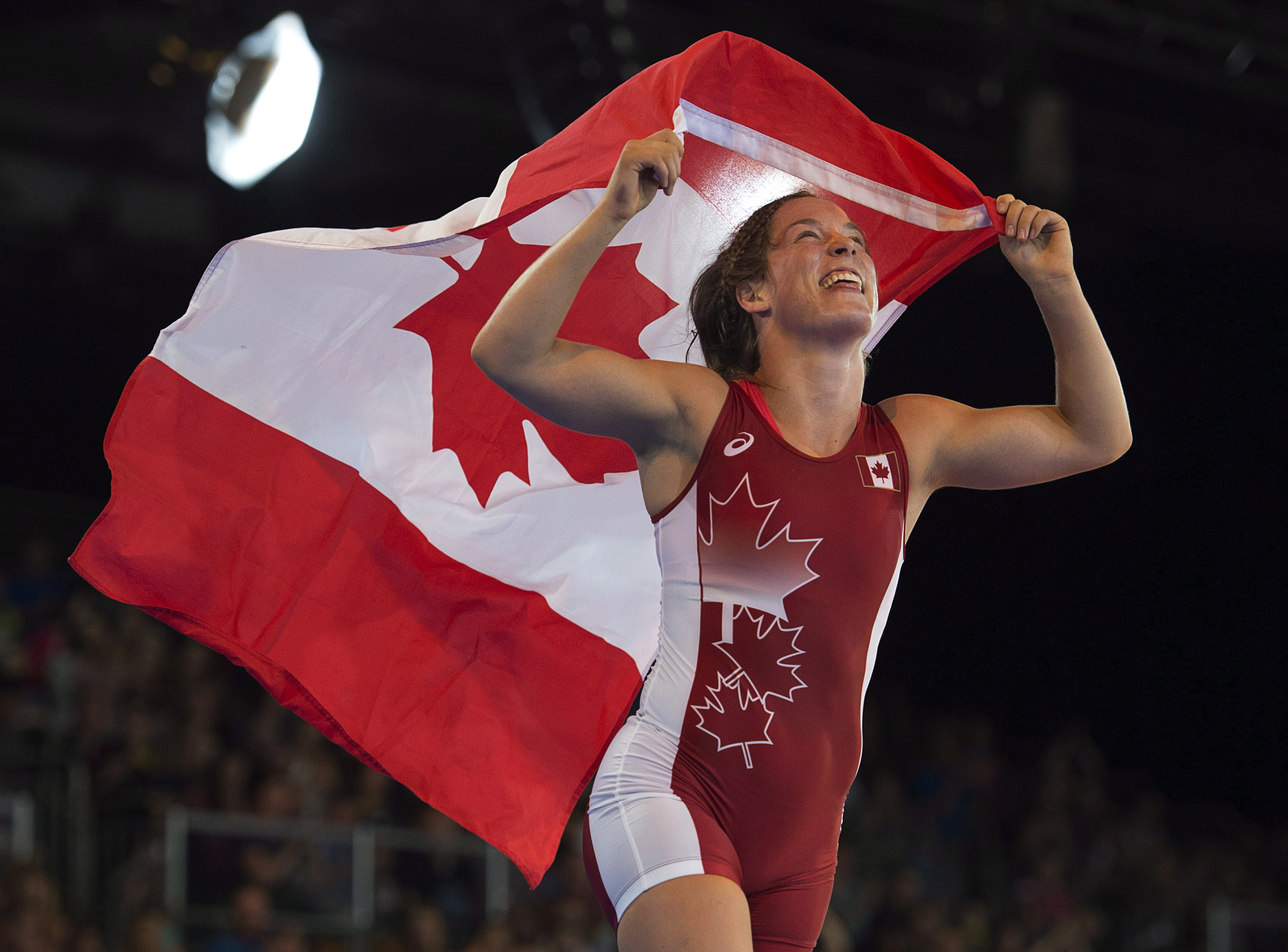 Canada's Danielle Lappage celebrates her gold medal in the women's freestyle wrestling 63-kilogram event at the Commonwealth Games action in Glasgow, Scotland on Thursday, July 31, 2014. 