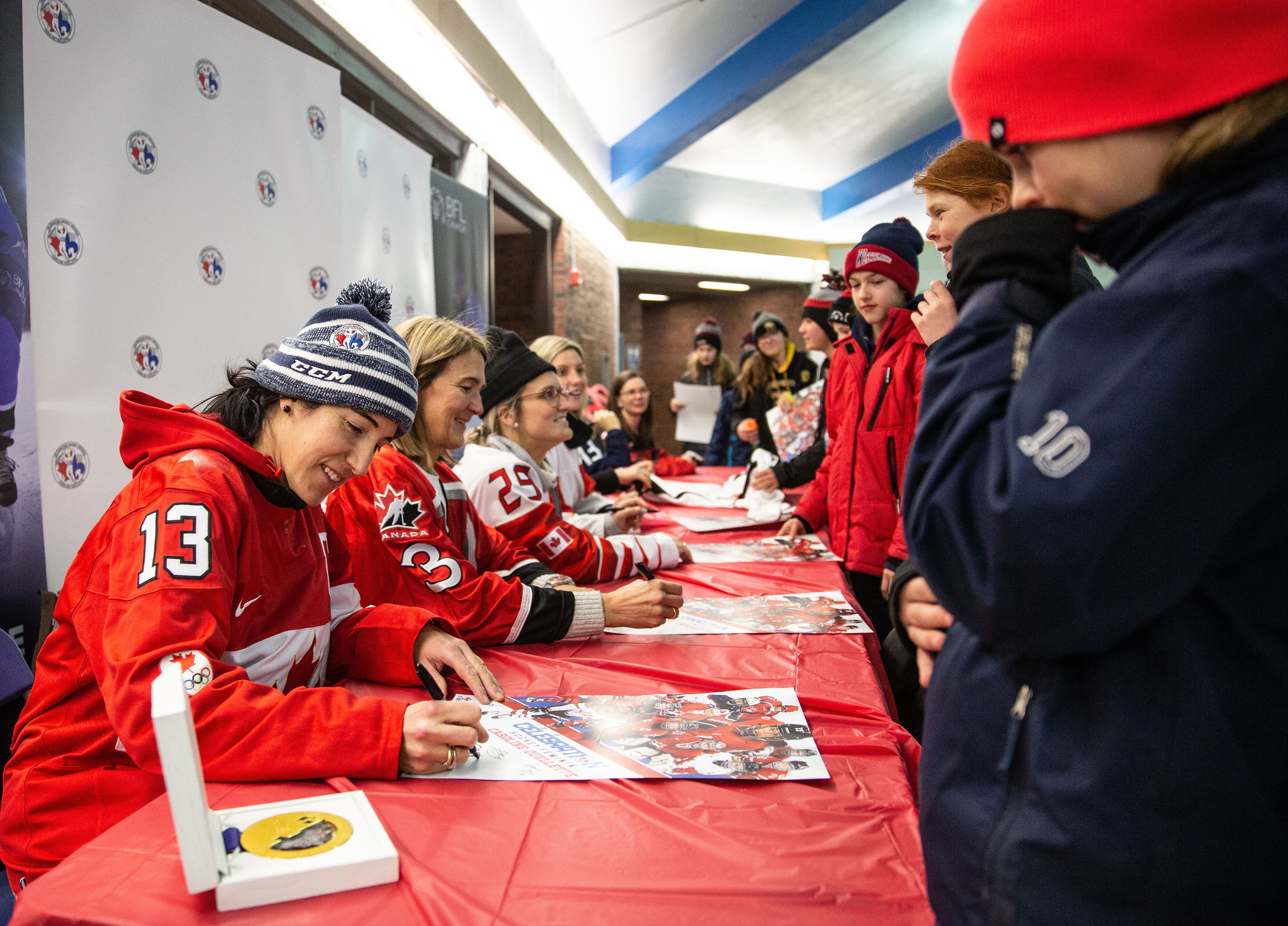 Players signing autographs