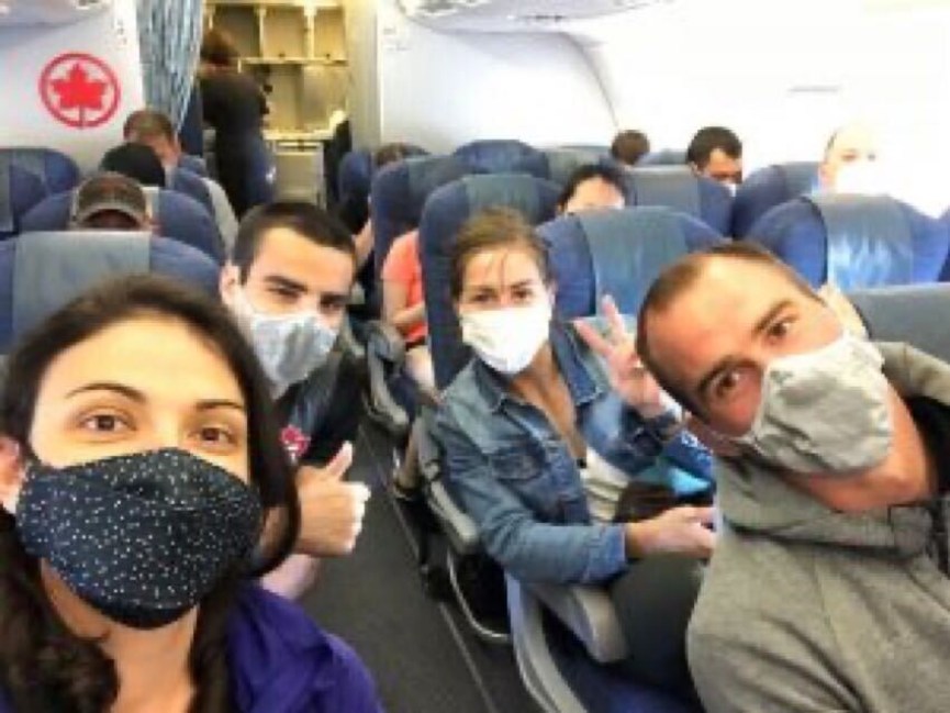 Judo national team members on airplane Judo national team members wear masks on airplane