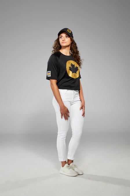 Kylie Masse is facing the camera in Tokyo 2020 closing ceremony t-shirt and jeans