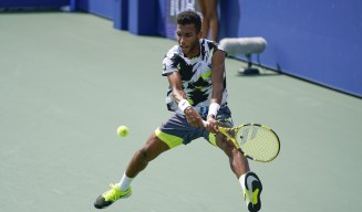 Felix Auger-Aliassime, of Canada, returns a shot to Thiago Monteiro, of Brazil, during the first round of the US Open tennis championships, Tuesday, Sept. 1, 2020, in New York. (AP Photo/Seth Wenig)