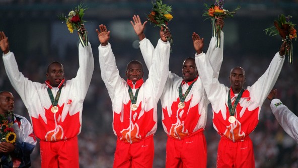 Donovan Bailey, Bruny Surin, Glenroy Gilbert and Robert Esmie Donovan Bailey, Bruny Surin, Glenroy Gilbert and Robert Esmie raise their hands as they celebrate gold.