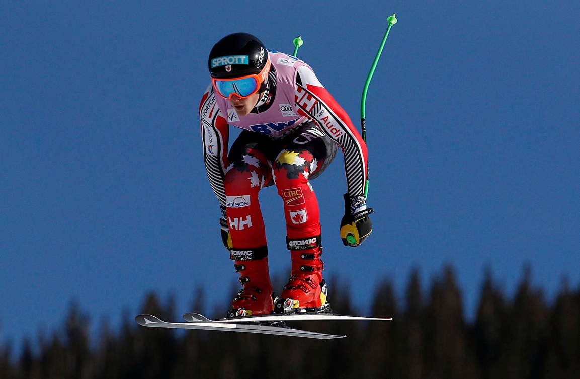 Brodie Seger mid-air during a downhill race.