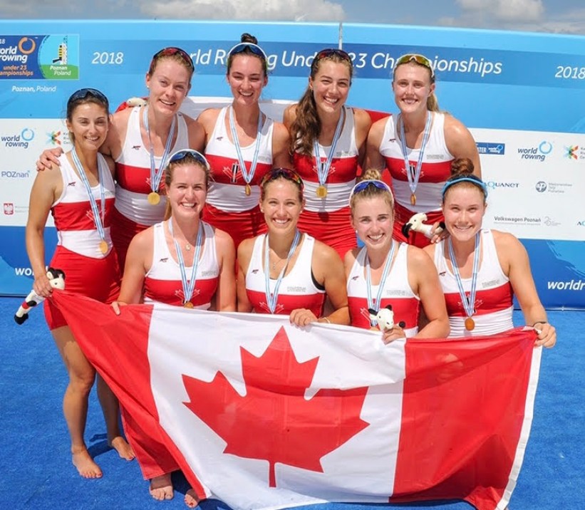 Avalon Wasteneys Group of Canadian rowers holding a Canadian flag