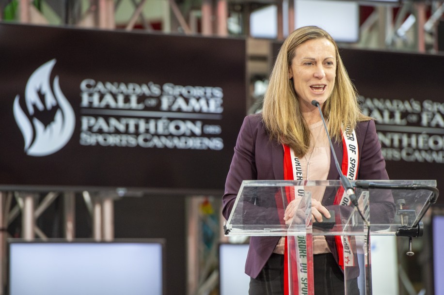 Jayna Hefford speaks at a podium