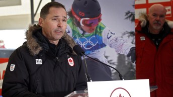 Chef de Mission Steve Podborski speaks at a news conference.