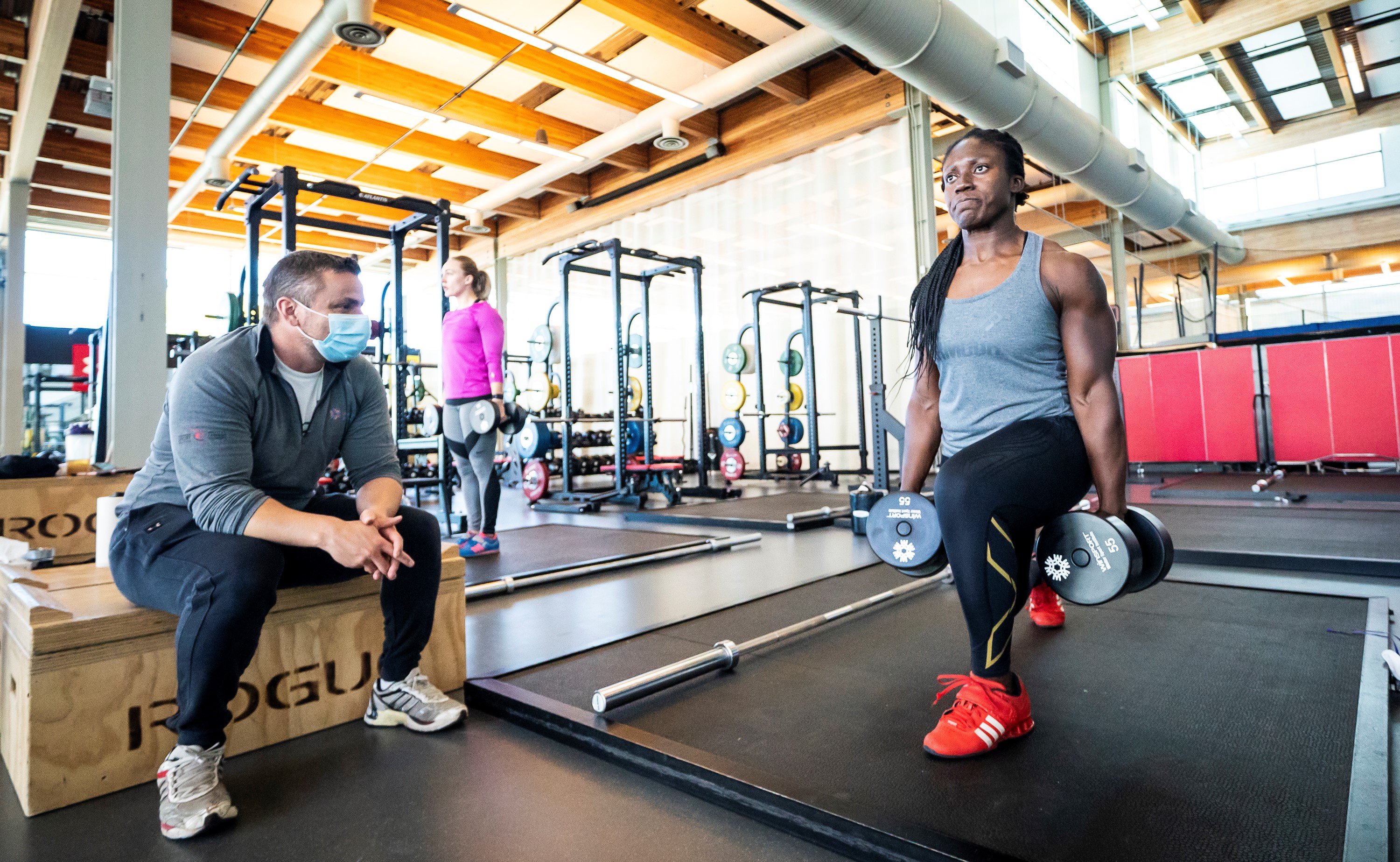 Cynthia Appiah lifts weights at the gym