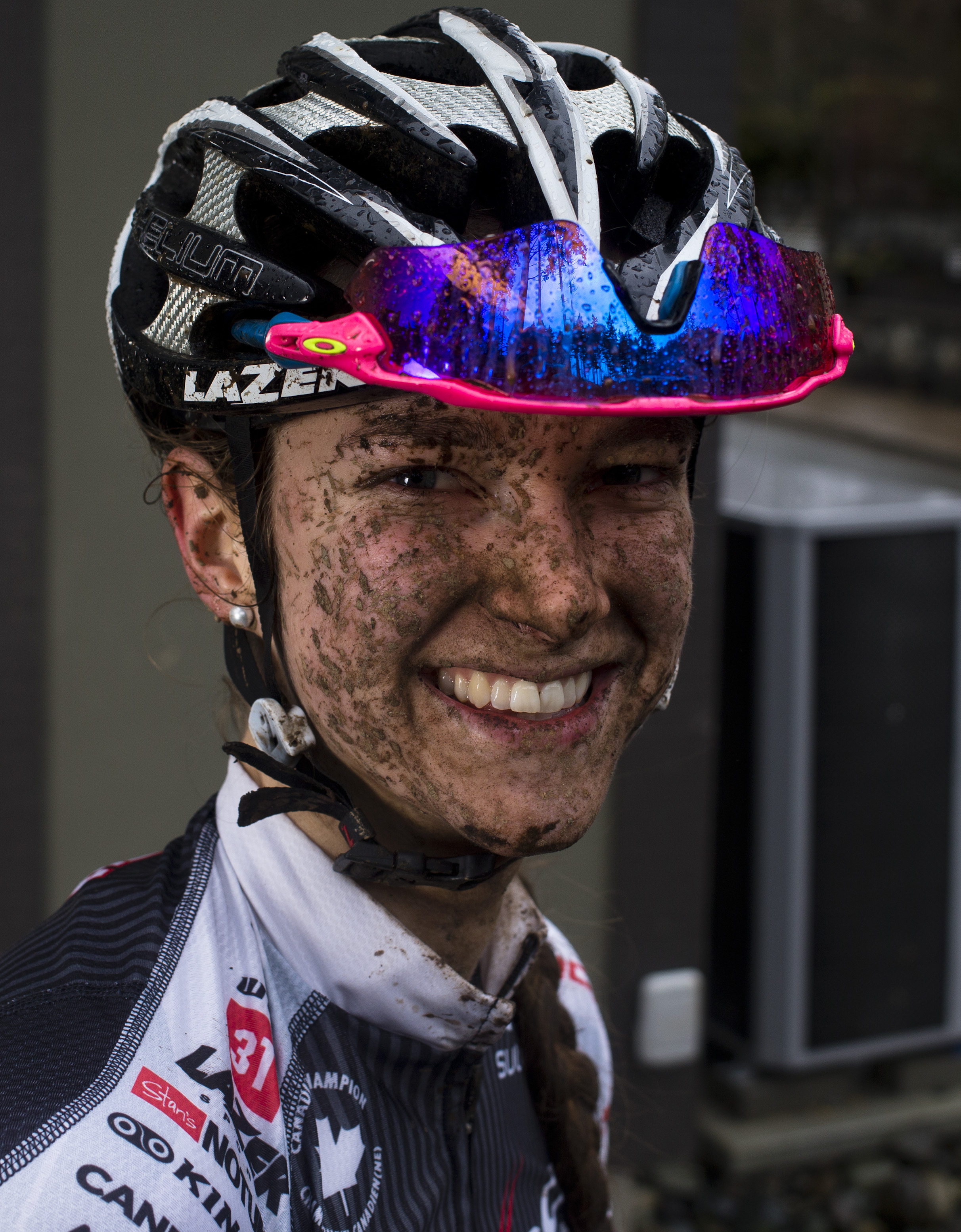 Haley Smith smiling with mud on her face