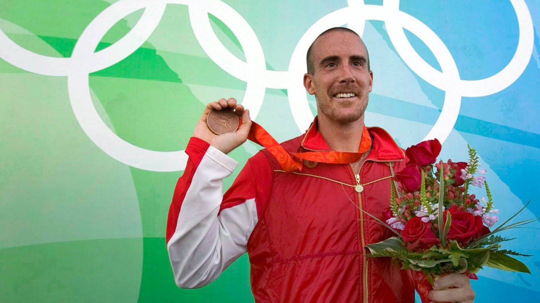 Tom Hall holds his bronze medal from Beijing 2008