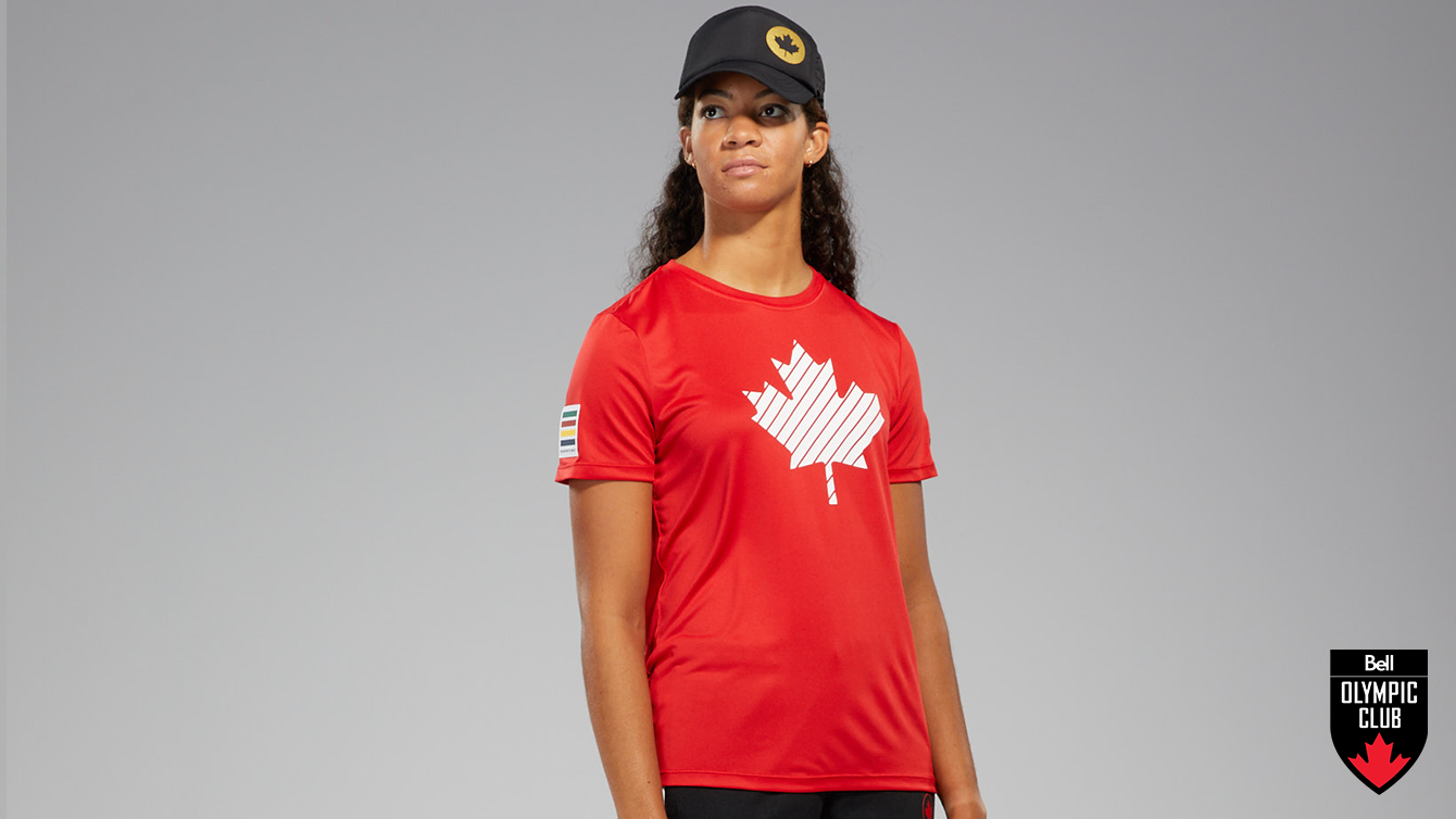 Athlete posing in red HBC shirt and black HBC hat
