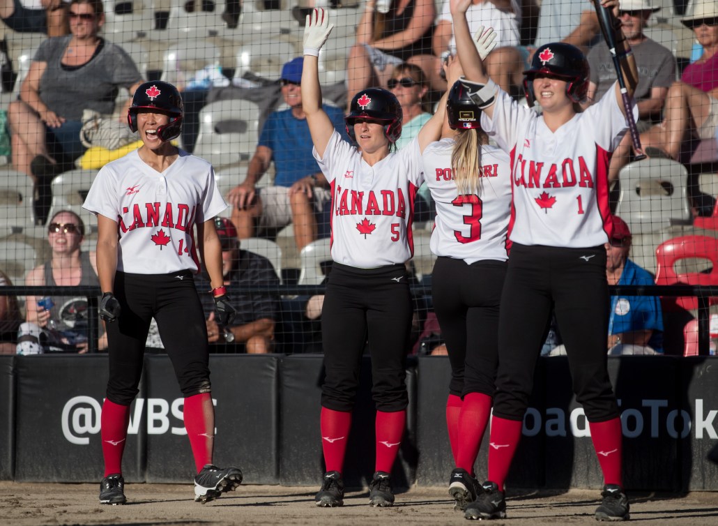 4 members of women's Team Canada's softball team cheering