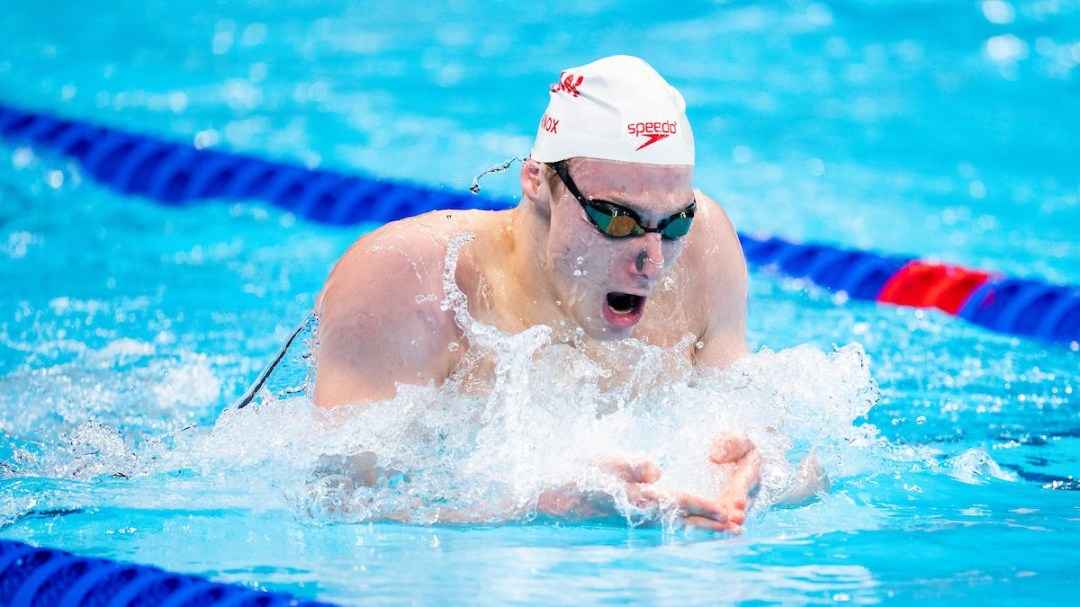 Finlay Knox swims breaststroke